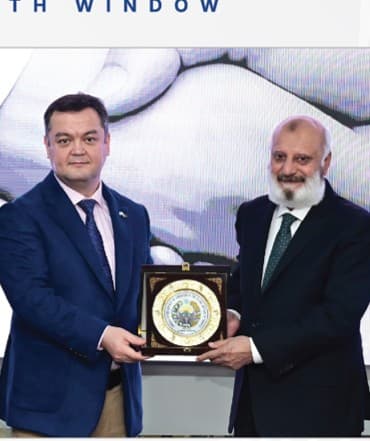 Exchanging shields at a Growth Window ceremony