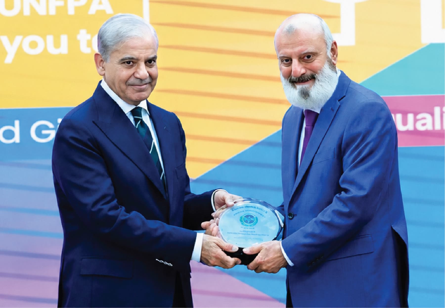 Prime Minister Shehbaz Sharif presenting the Women Empowerment Award to Muhammad Anwar Dar